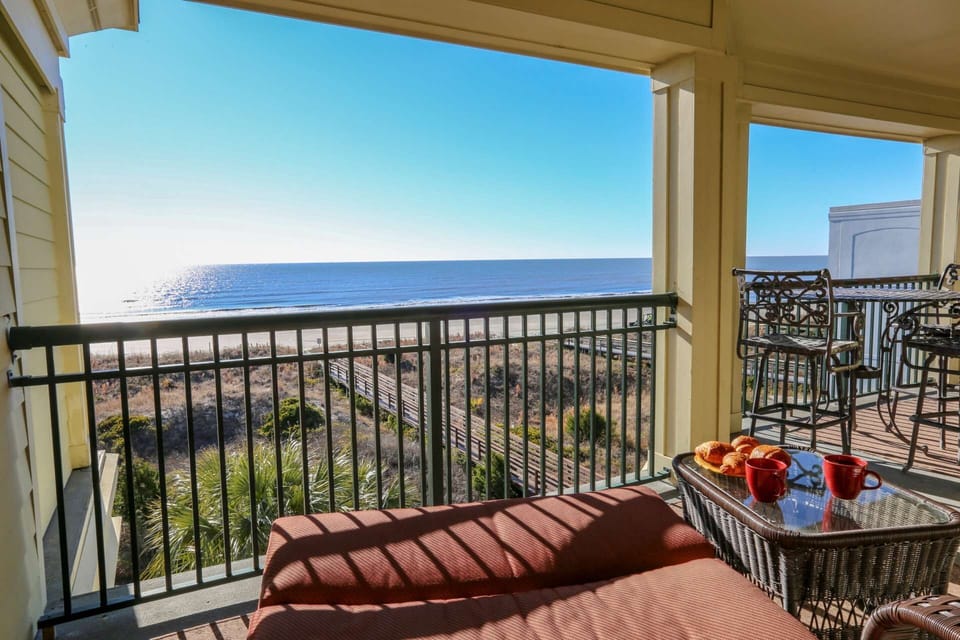 This chair on the covered balcony is the perfect spot for your morning coffee.