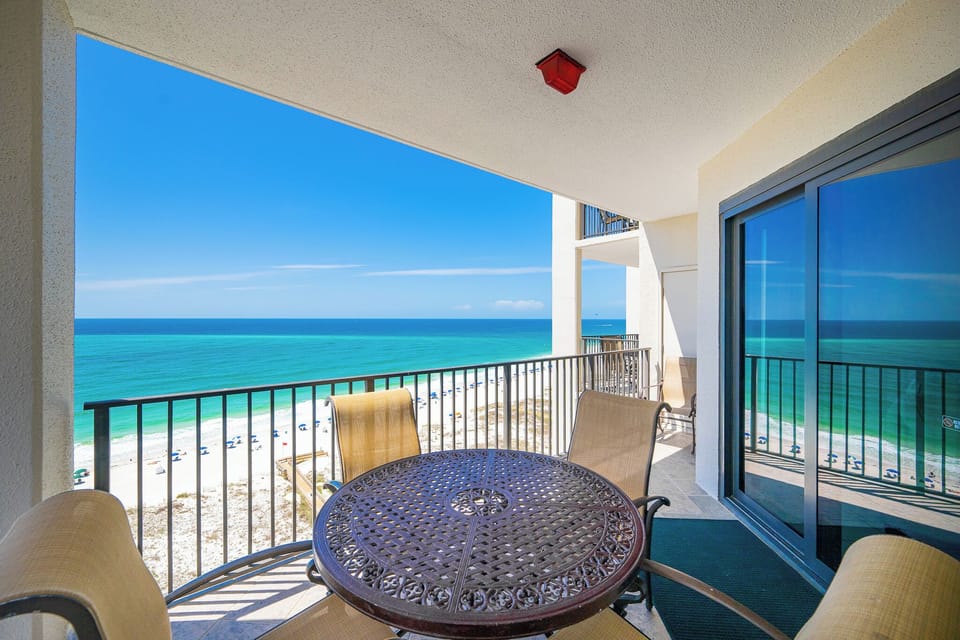 Your balcony invites you to savor gentle gulf breezes while lounging at the round table beneath blue skies