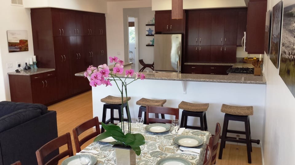 Dining table for 8 plus 4 seats at bar and fully stocked gourmet kitchen