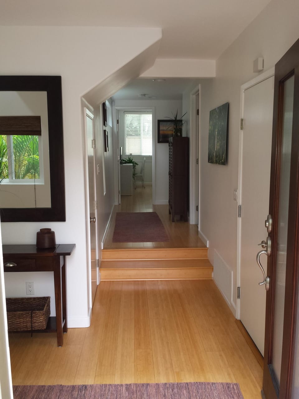 Entry to your beach vacation with bamboo floors and coastal furnishings