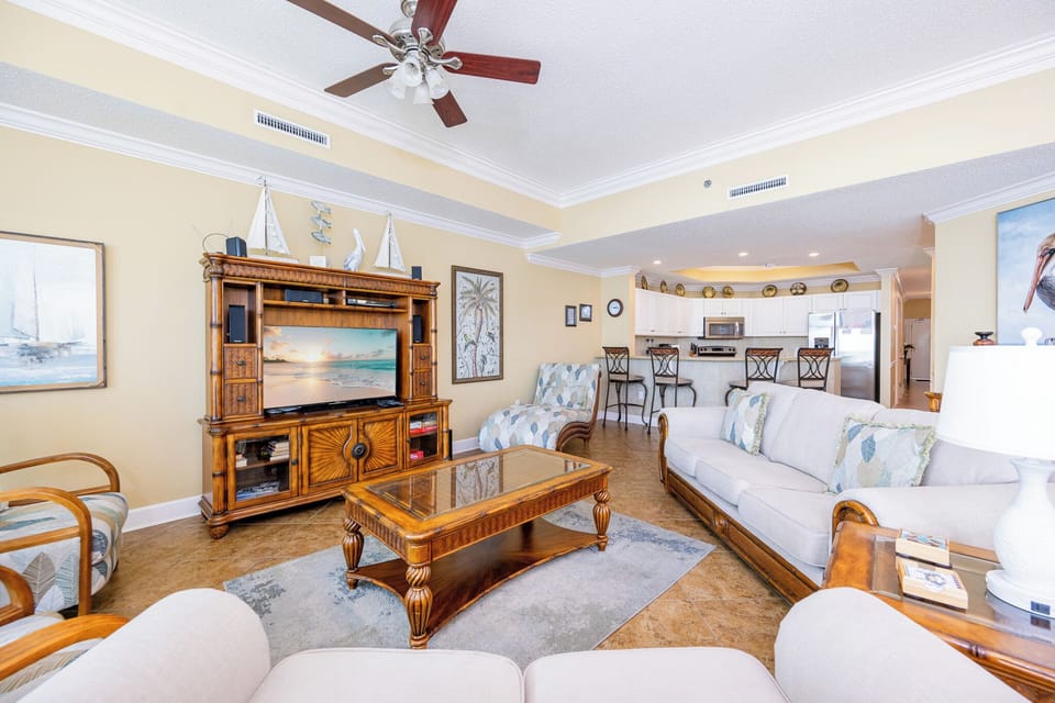 Unwind in the inviting living room, streaming your favorite shows while enjoying coastal decor and a cozy vibe