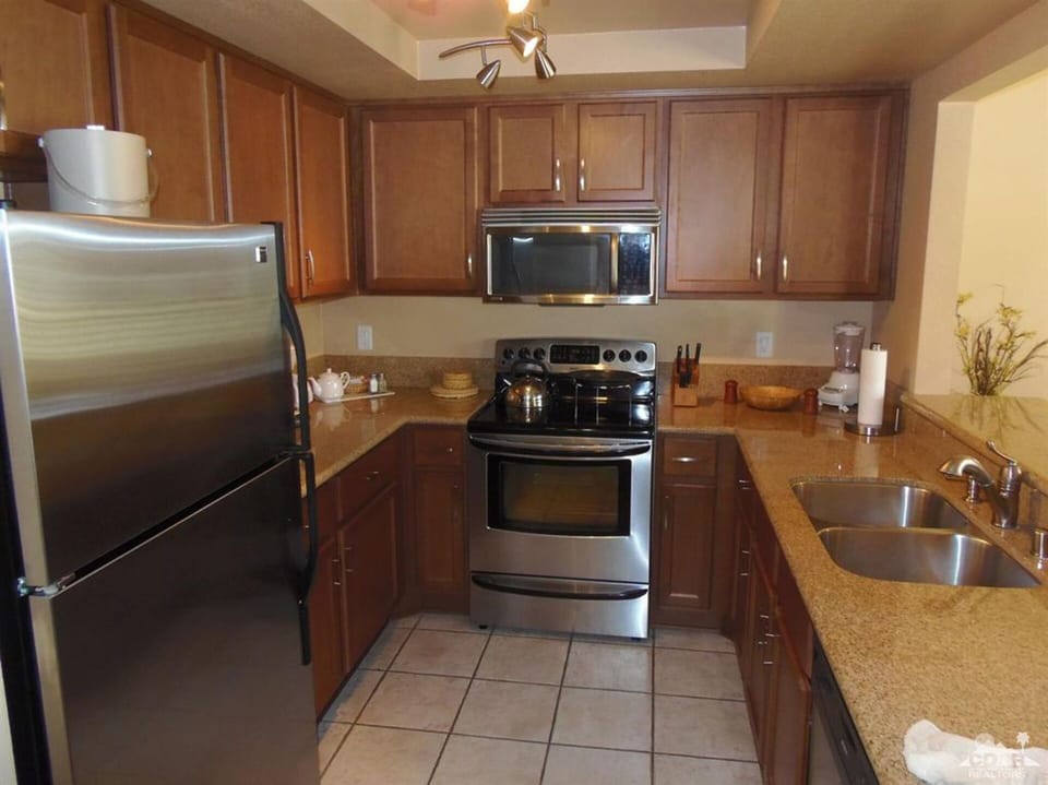 Updated kitchen with granite counters and stainless appliances