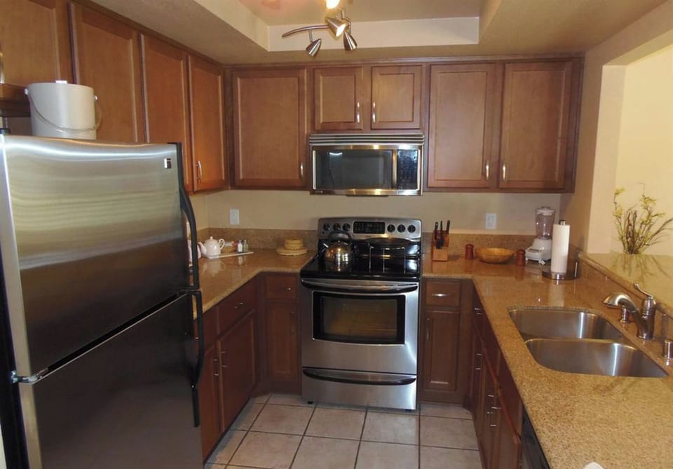 Updated kitchen with granite counters and stainless appliances