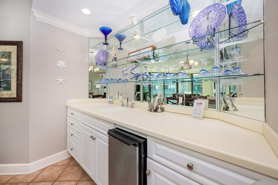 Grab a chilled drink from the fridge or create your favorite cocktail at the wet bar