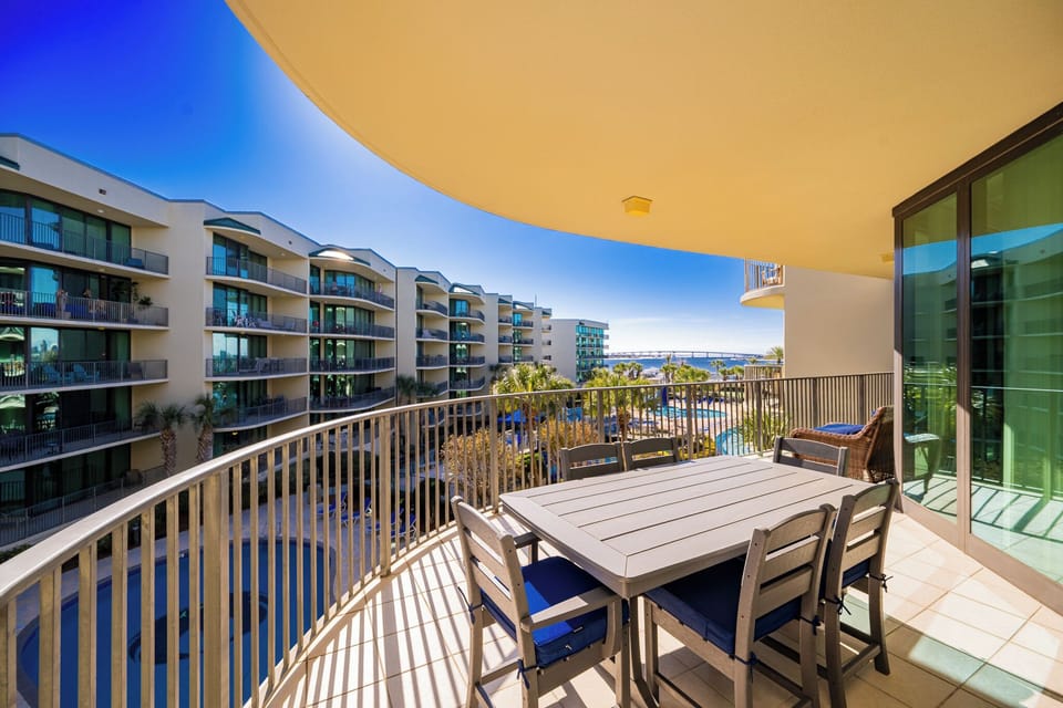 Savor warm breezes on the balcony while unwinding with stunning views of the bay and pool area