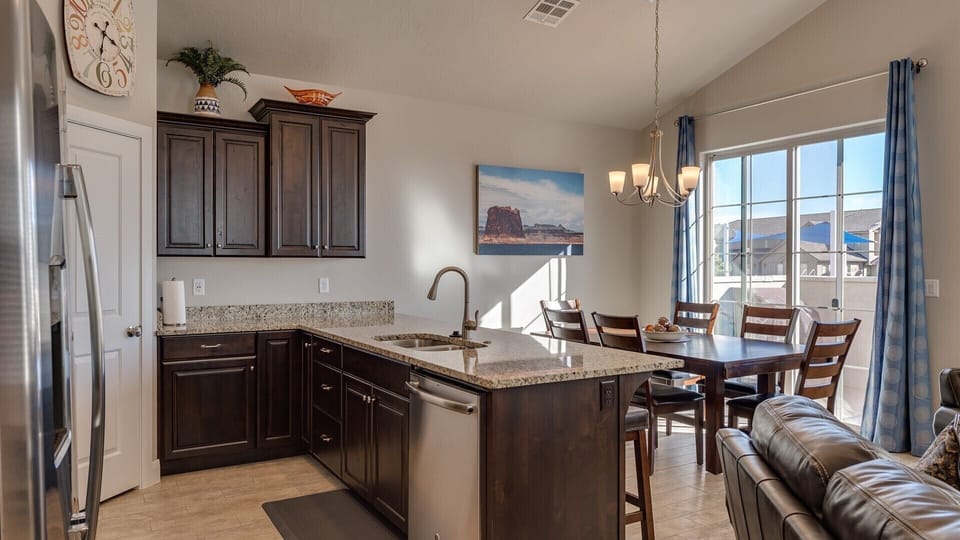 Fully stocked gourmet kitchen with stainless steel appliances