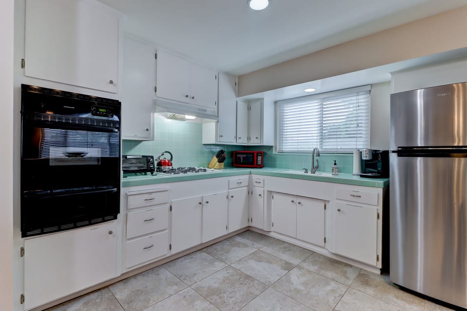 Microwave, toaster oven, pod coffee maker, dishes, cooking ware, utensils
