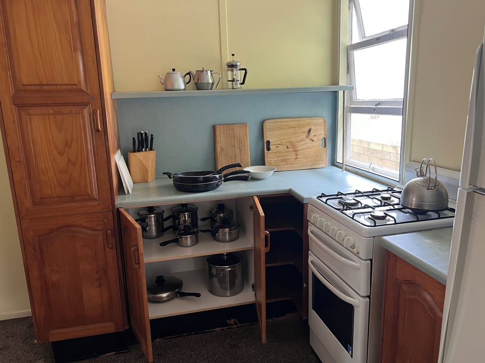 pots,pans, kettle, cutting boards, knives, teapot, coffee plunger