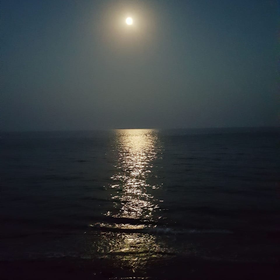 Moonlight reflecting in the  sea, seen whilst sitting by the poolside