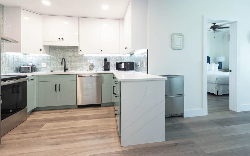 Prepare meals in this stylish kitchen with a sleek design, modern appliances, and elegant tile accents