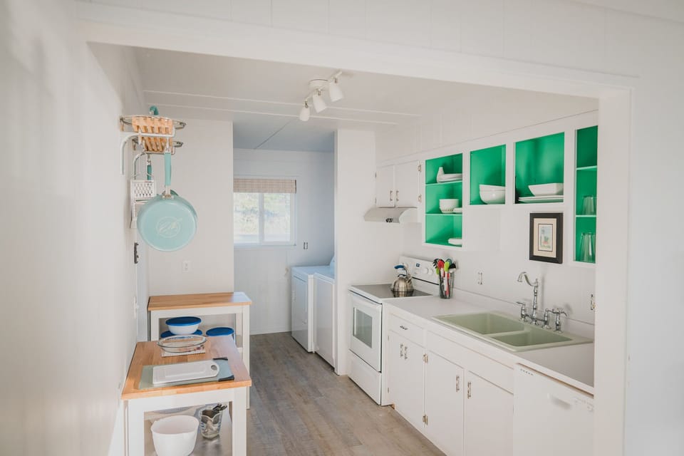 Crisp, clean and simple design makes it easy to create meals in this quaint kitchen.