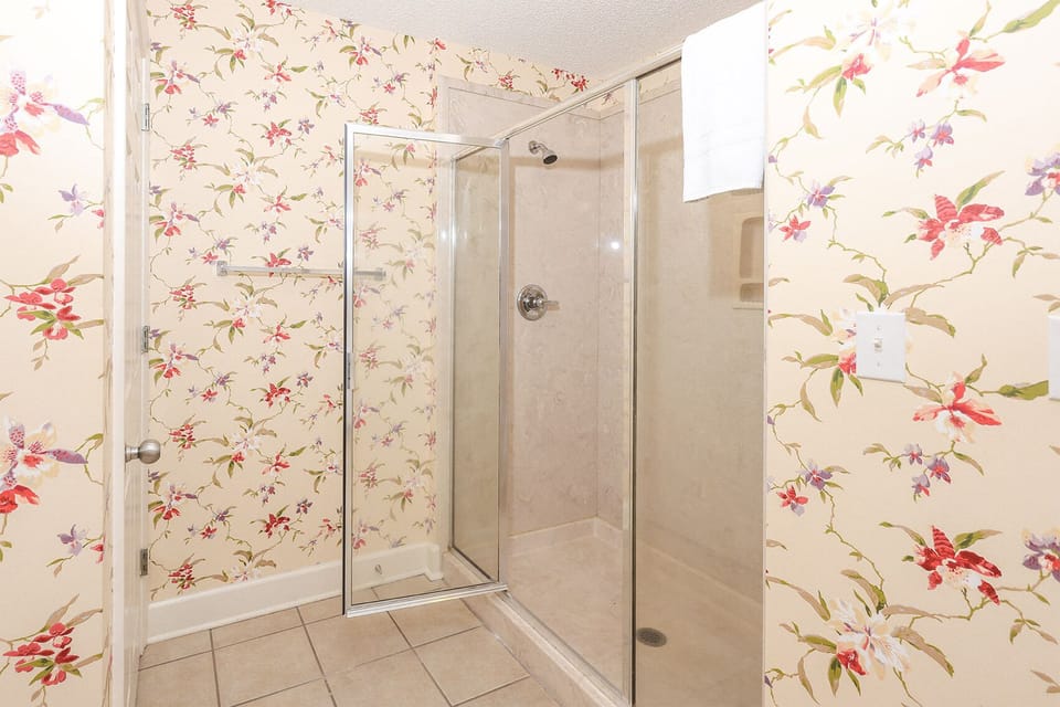 Indulge in relaxation in the master bath with a refreshing walk-in shower and soothing jetted tub