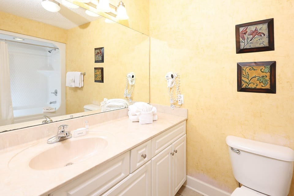 Pamper yourself in this guest bath for morning routines and get ready for fun beach adventures