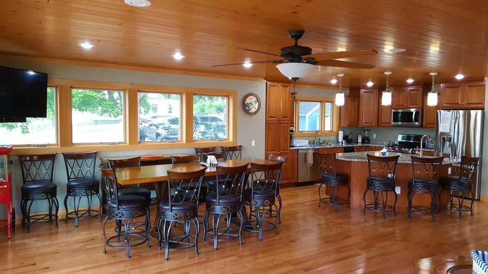 Open-concept and 16ft floor-to-ceiling glass doors for uninterrupted river views