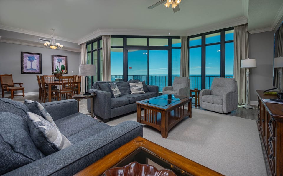 Relax on the cozy sofa with a queen sleeper in this inviting family room with breathtaking beachfront views
