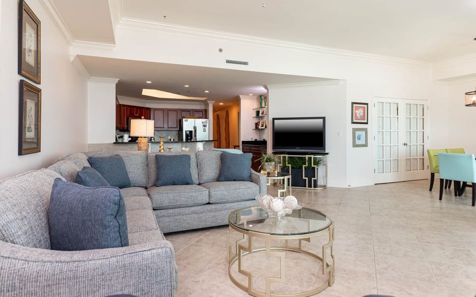 Sink into the plush sectional and enjoy quality time with loved ones in this inviting family room