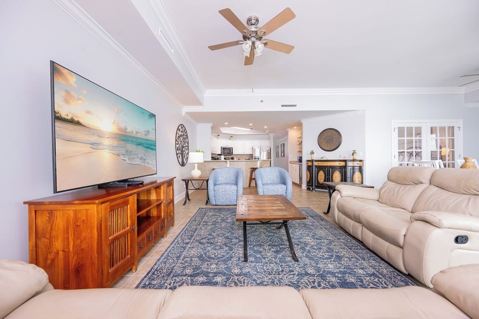 Relax in cozy seating while streaming your favorite shows on the large flat-screen TV in this inviting living space