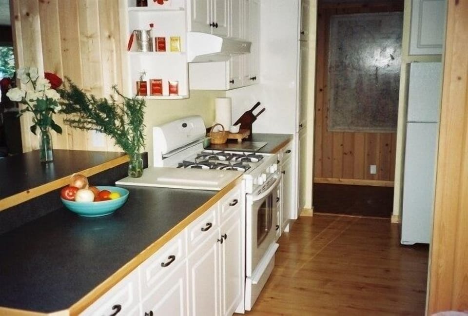 Cook's kitchen features gas stove and all the equipment you'll want.