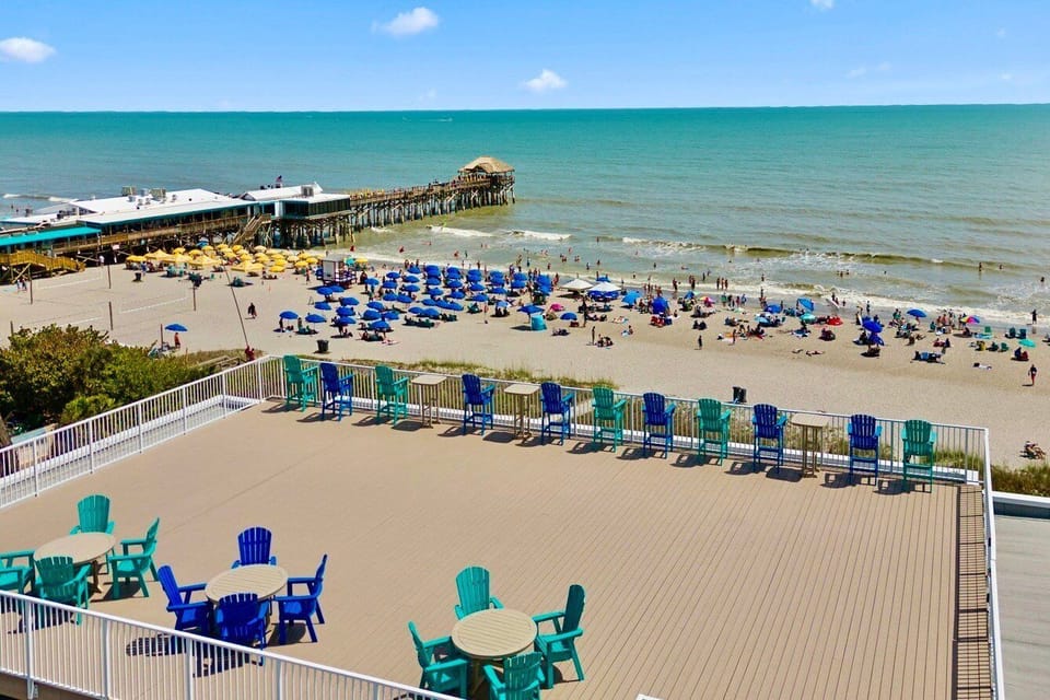Relax on the sandy beach just steps from your vacation home