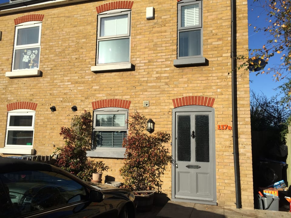 Front of house with drive for two cars