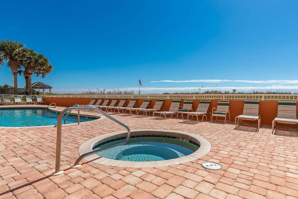 Soak up the sun in the beachfront hot tub by the pool or grab a lounger and relax on your next vacation to Seacrest