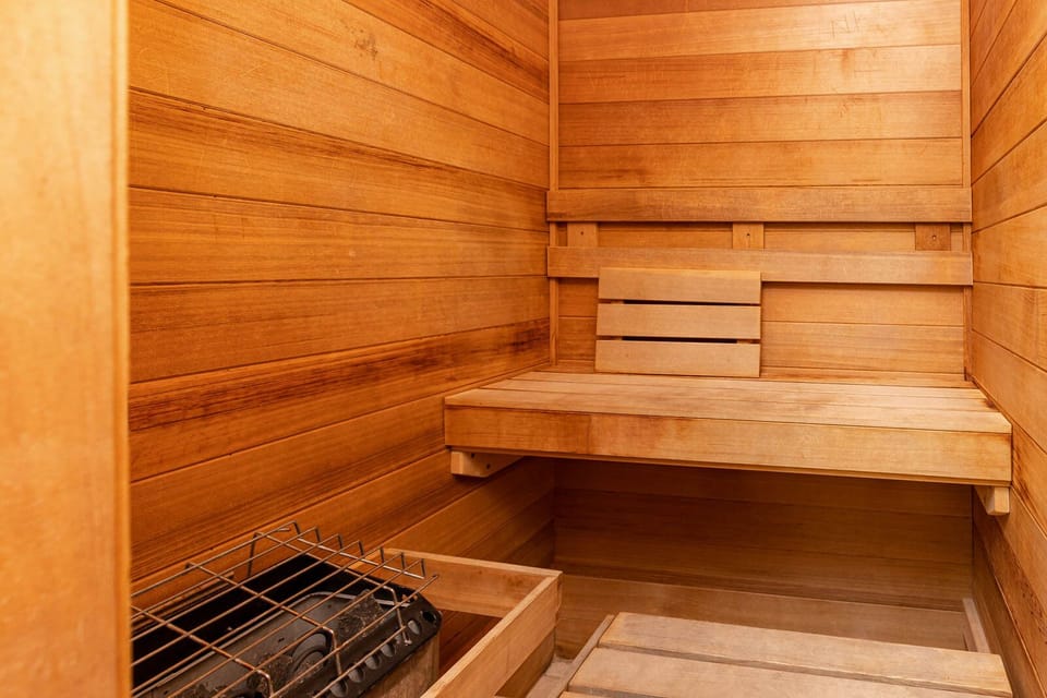 Relax in this warm wooden sauna, perfect for unwinding after a day at the beach