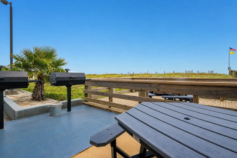 Fire up the grill and enjoy a delicious meal with the beautiful beach just steps away