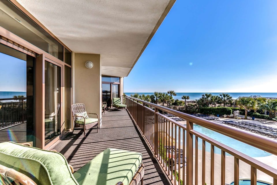 Relax with front-row views of the pool and ocean—just steps away, no elevator ride required.