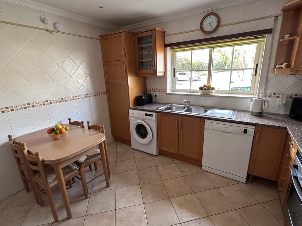 The kitchen has a washing machine and dishwasher and built in fridge freezer.