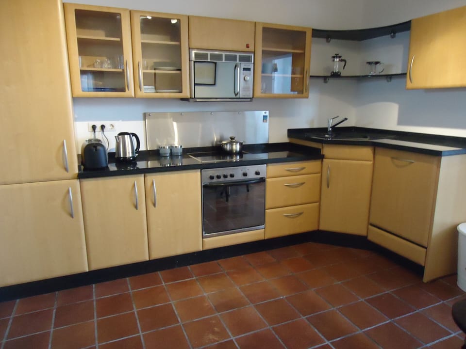 Full size kitchen with integrated appliances.