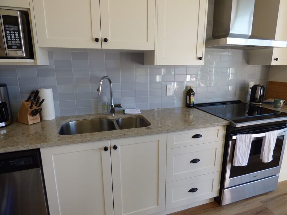 Fully fitted kitchen with dishwasher and oven complement the Weber barbecue
