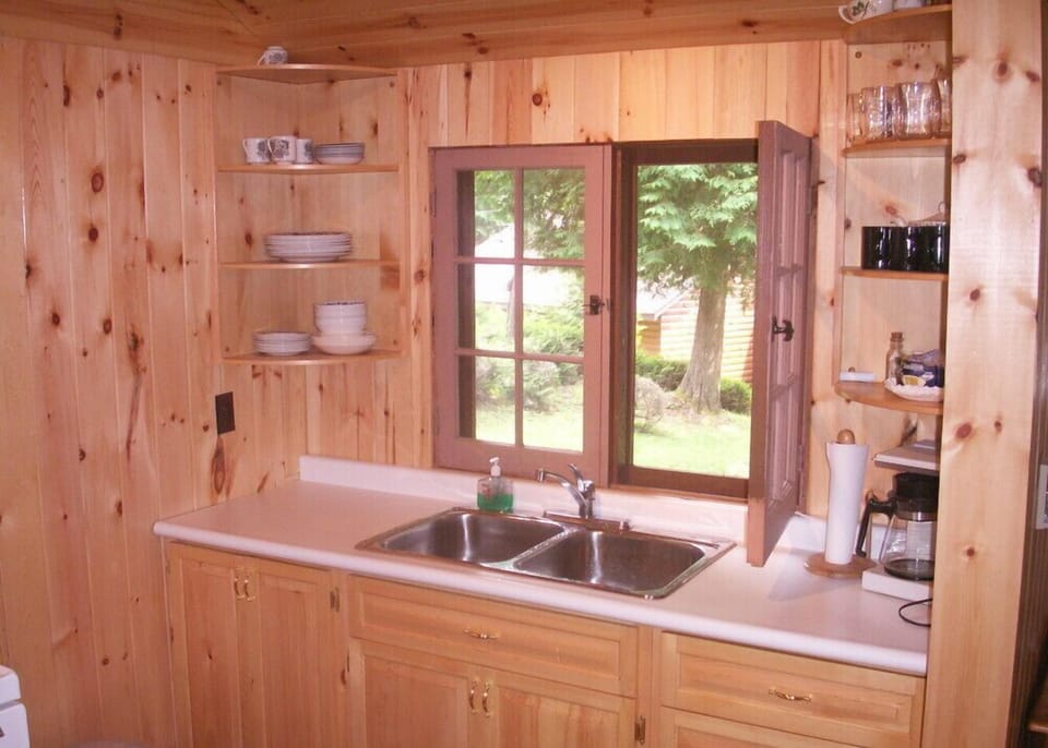 Kitchen with counterspace.bright and airy inside.lots of Windows to experience lake and property