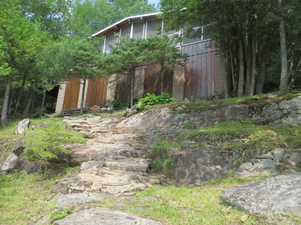 Landscaped with natural stone steps.