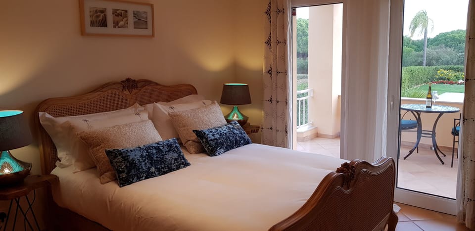Master Bedroom with ensuite leading to own terrace overlooking pool and gadens.