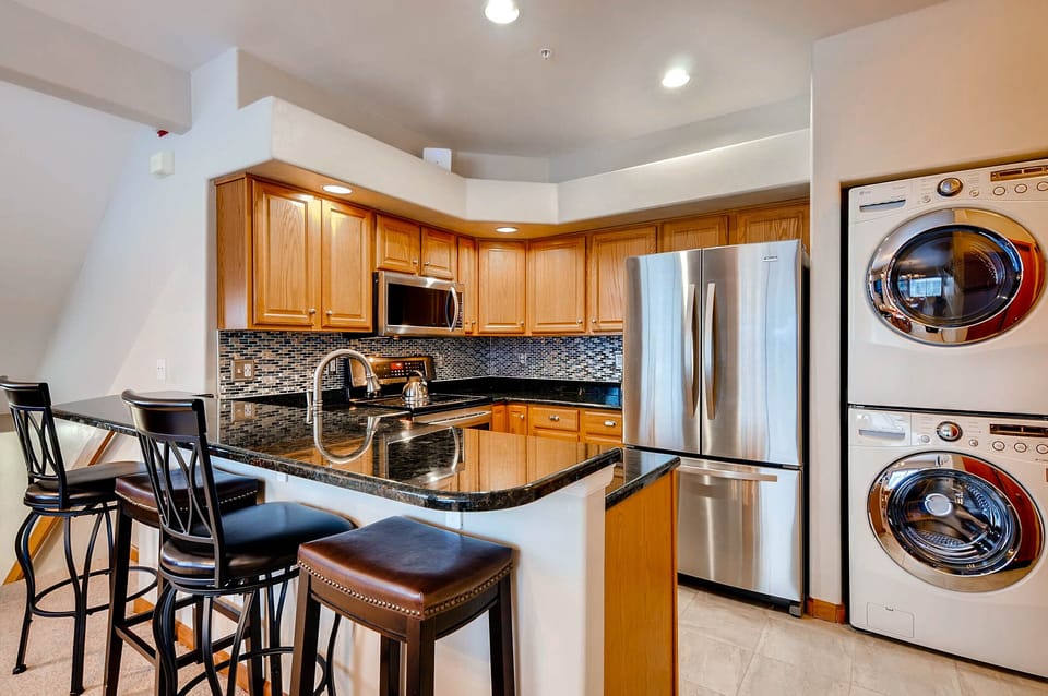 Full washer and dryer right off of kitchen.