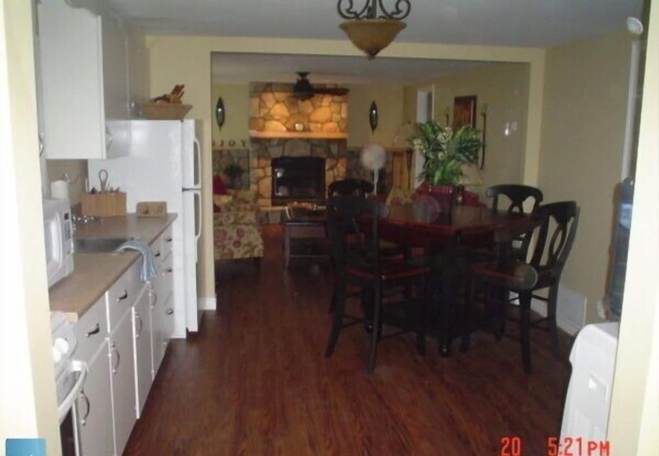 Fireplace adds to the ambiance of the cottage and big picture windows for an amazing view of the lake
