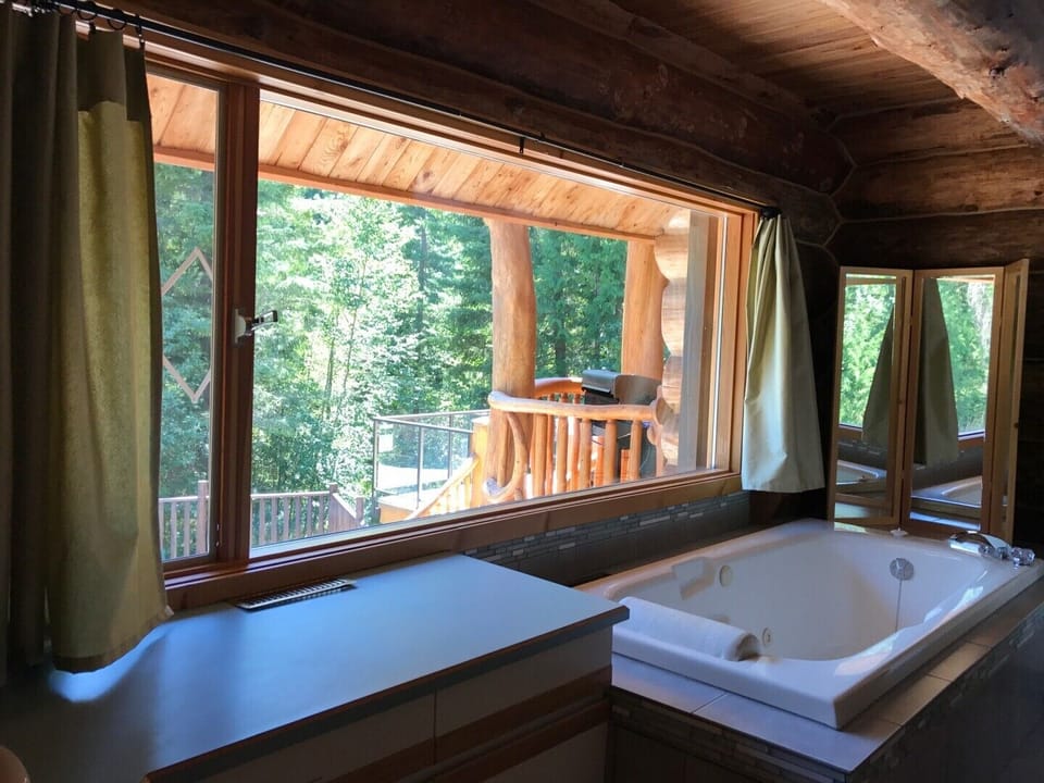 Main bathroom on the first floor with jetted bath and separate shower