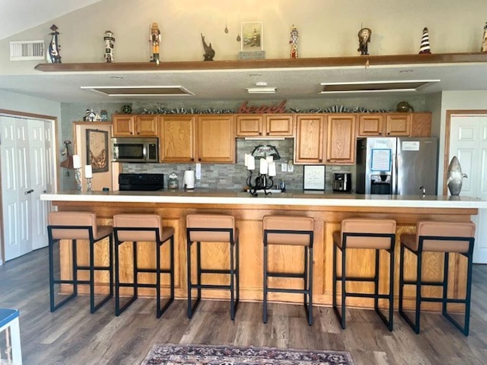 Nice Galley kitchen with new leather bar stools. 