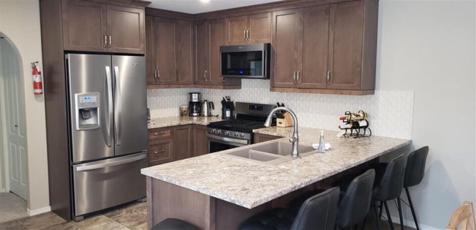 Main Floor Kitchen with 4 Stool Eating Bar.