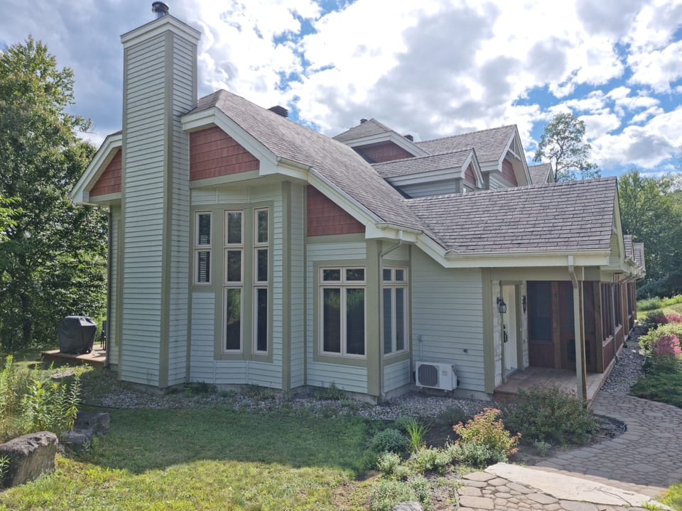 Outside view of property with large windows