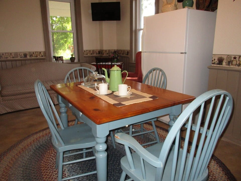This cute, country kitchen offers places to sit and visit or eat.
