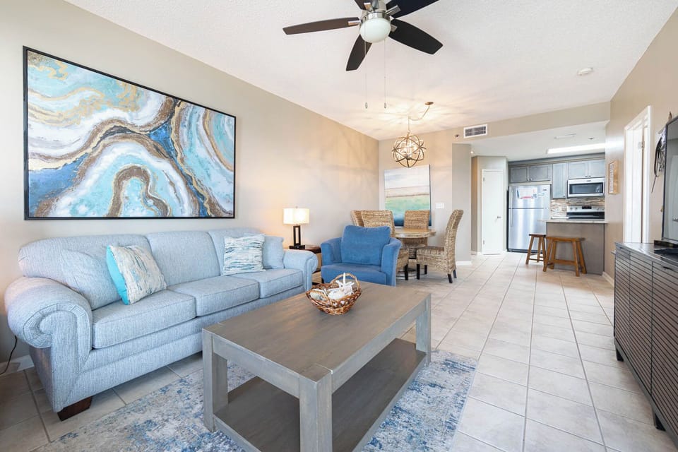 Relax in the inviting living area, featuring a cozy couch with queen sleeper and stylish decor