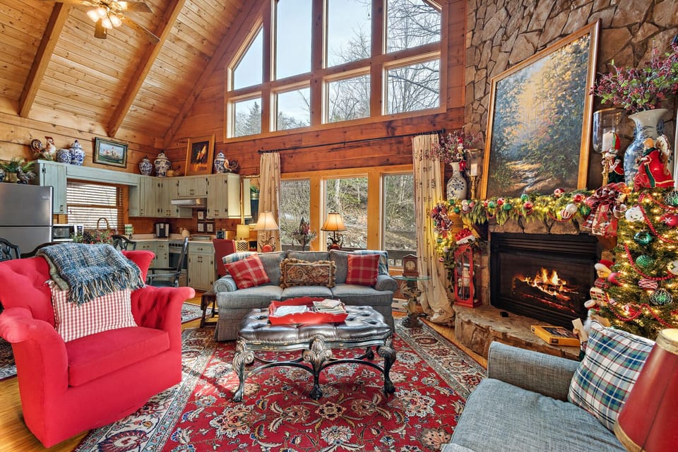 Living Room with Floor to Ceiling Stone Fireplace and Huge Windows