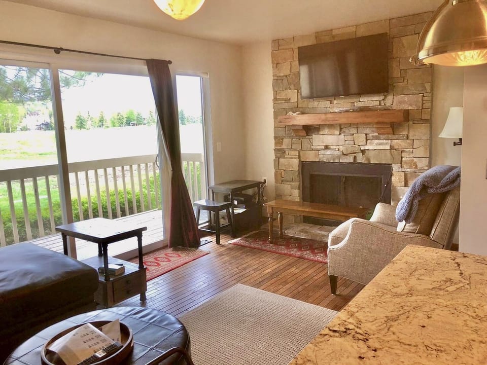 Full remodel wood floors, new real stone fireplace with HD TV