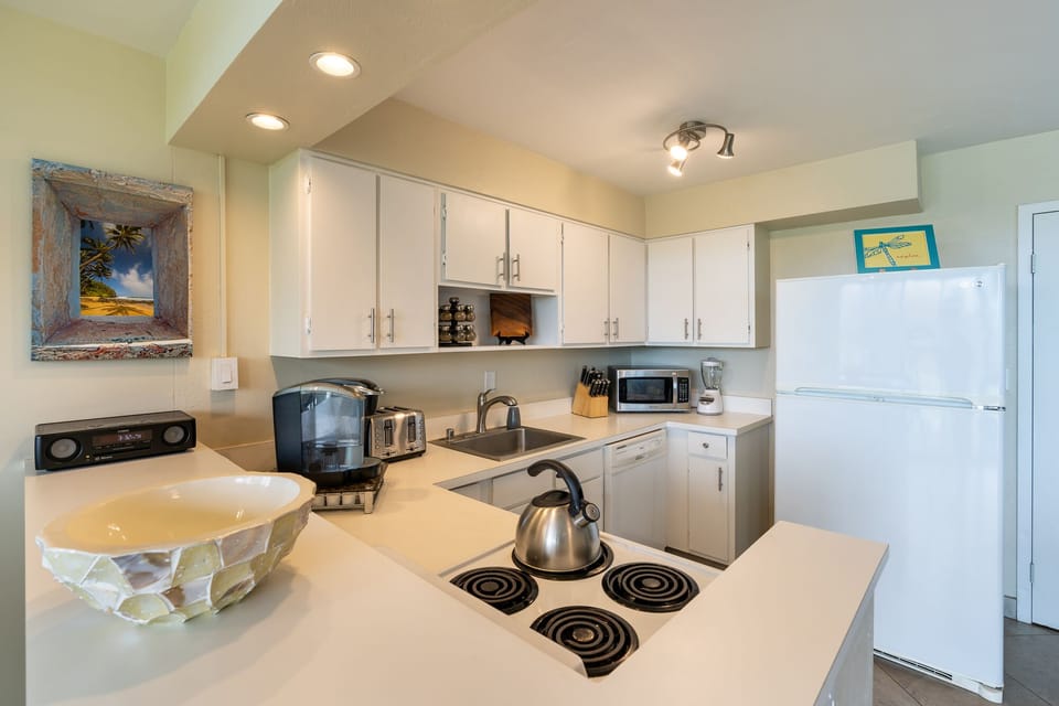 Kitchen fully stocked with cookware and utensils for cooking your own meals