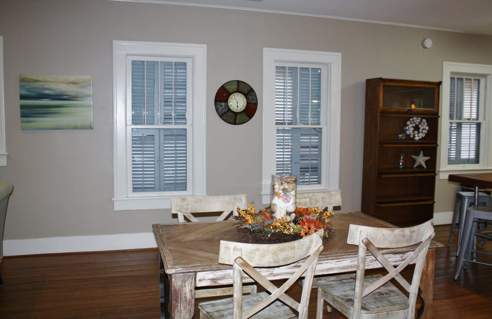 Dinning table is reclaimed wood, fitting with the theme set by the island top.
