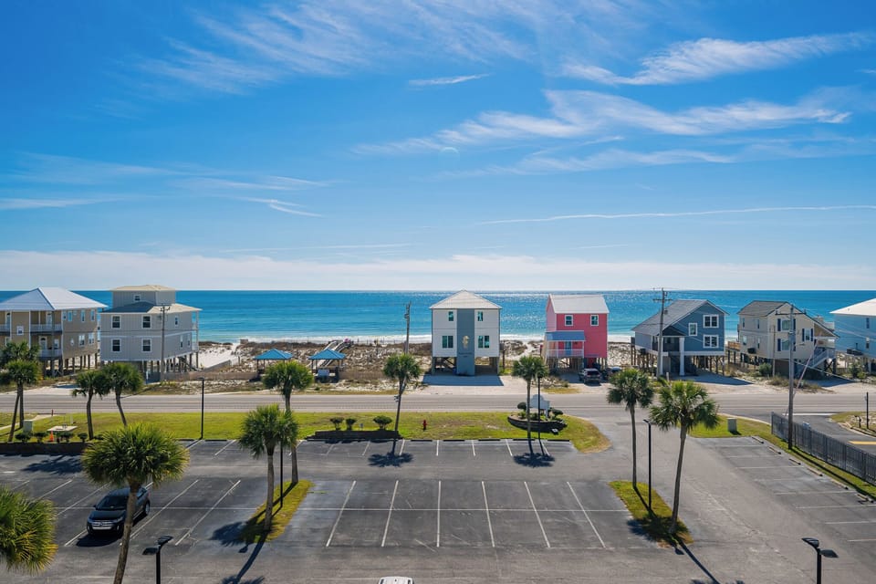 Experience relaxation on your balcony, taking in the vibrant atmosphere of your beach retreat