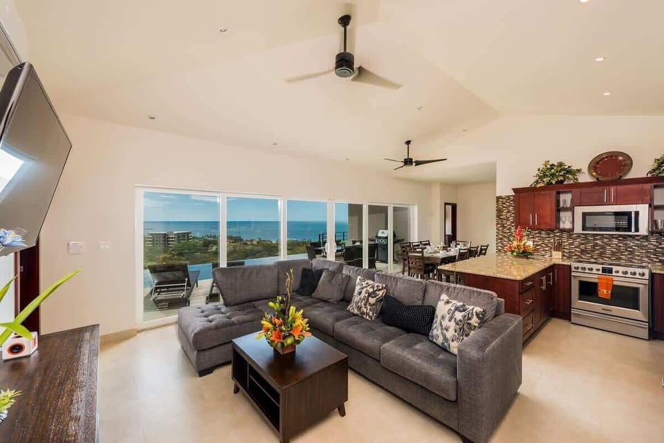 Another view of the living area, kitchen and dining area