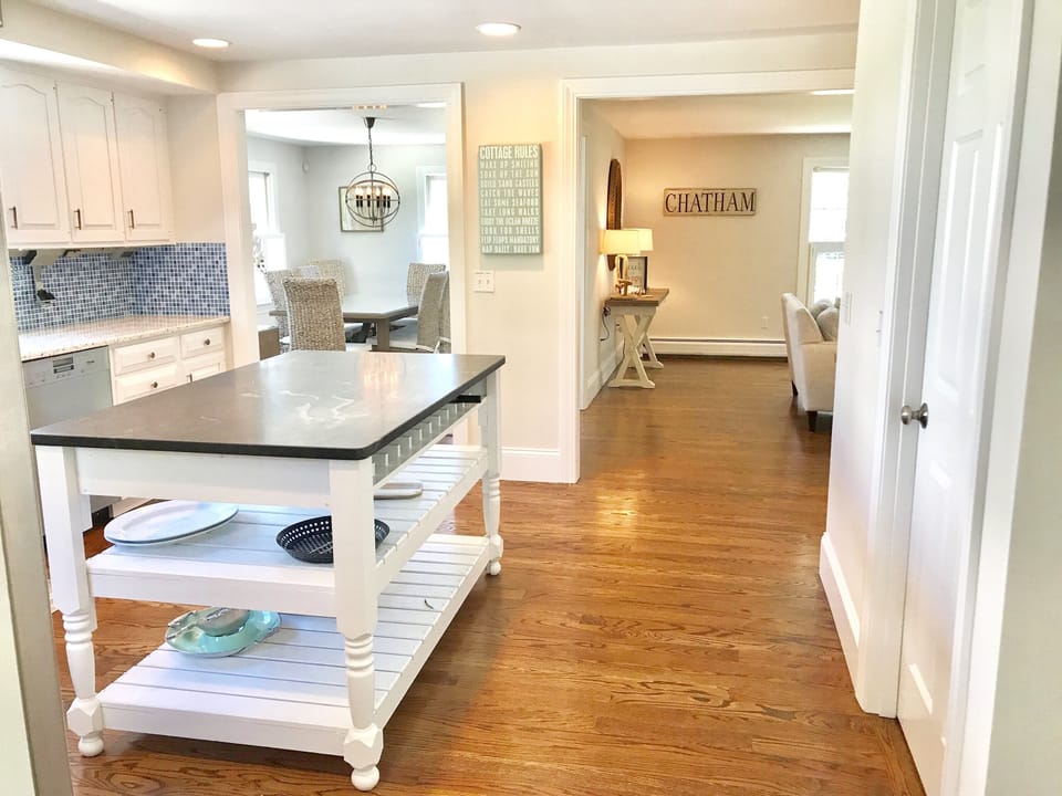 View from kitchen into living room & dining room from kitchen.