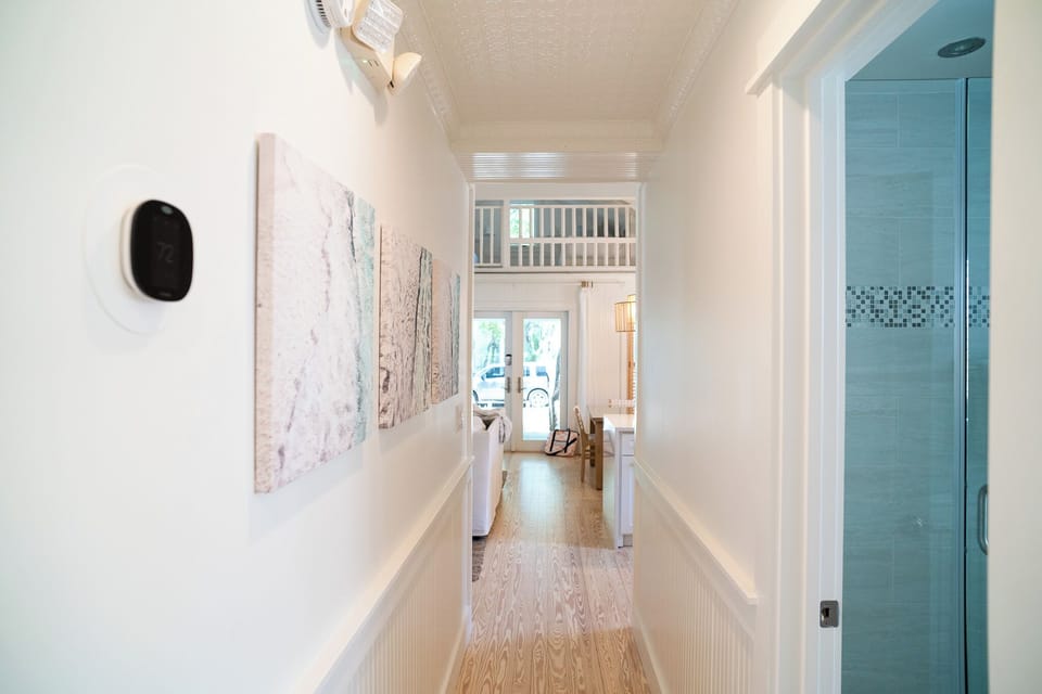 HALLWAY LEADING TO BEDROOMS AND A HALL, FULL BATH
